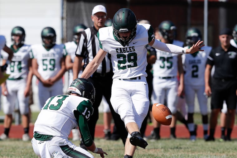 West Deptford's Brandon Ratcliffe kicking a 34-yard field goal, with holder Aaron Graeber, against Paulsboro .