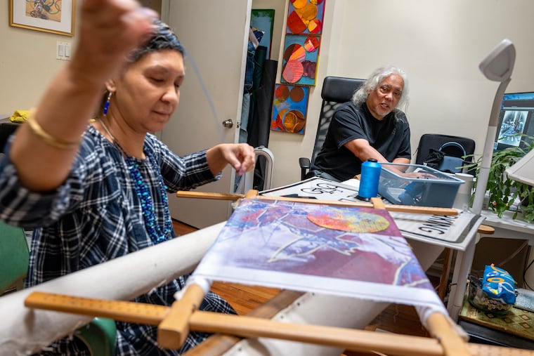 Duwenavue Santé Johnson and Joseph Carrillo  work together in her home office during a recent long weekend visit. She works as a senior hand embroiderer for the Defense Logistics Agency, making presidential flags. 