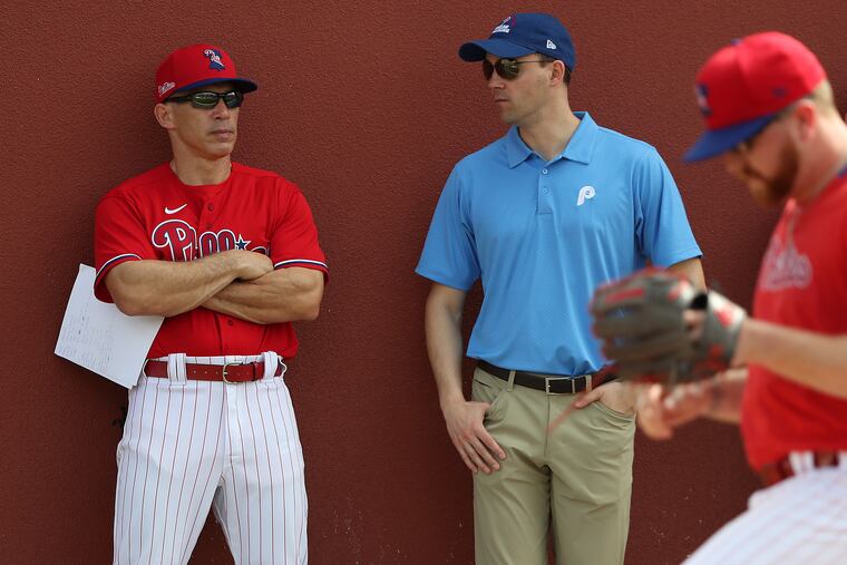 Matt Klentak (center) with Phillies manager Joe Girardi at spring training in February.