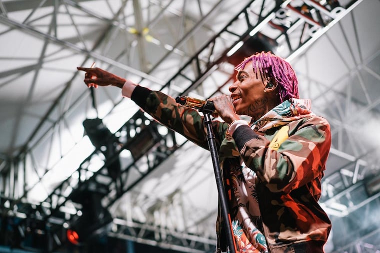 Wiz Khalifa at the Piazza at Schmidt's in Philadelphia in 2014. His 'Decent Exposure' tour plays the BB&T Pavilion in Camden on July 18. (Serge Levin / Philly.com)