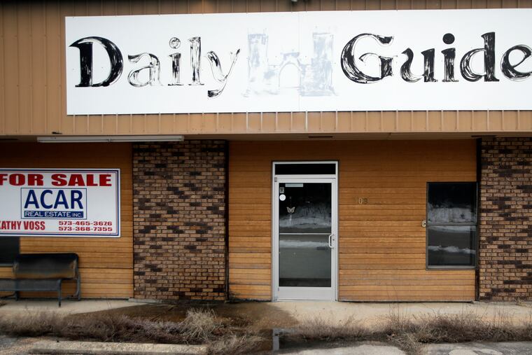 In this Feb. 19, 2019 photo, the old Daily Guide office stands for sale in St. Robert, Mo. With the shutdown of the newspaper in September 2018, this area in central Missouri's Ozark hills joined more than 1,400 other cities across the United States to lose a newspaper over the past 15 years, according to an Associated Press analysis of data compiled by the University North Carolina. (AP Photo/Orlin Wagner)