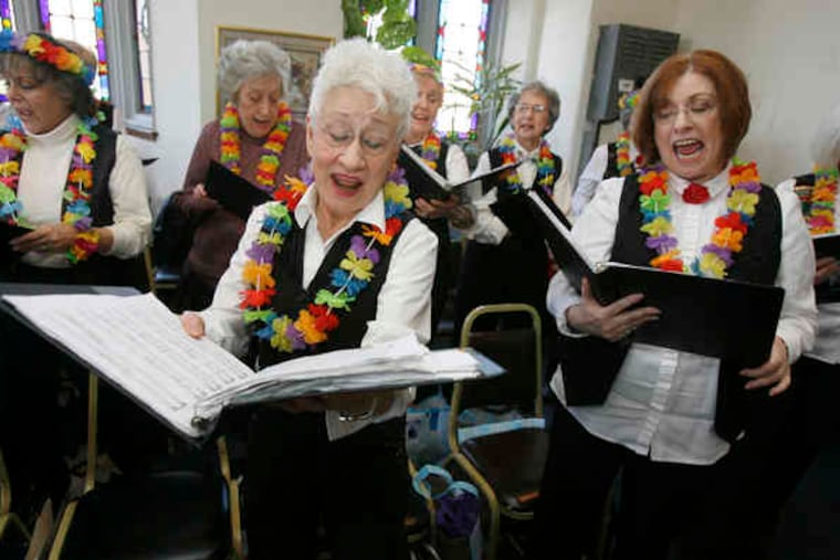 Members Barbara Browne (front left) and Ilene Beckman rehearse a "South Pacific" song with New Horizons Senior Glee Club. "Sometimes, we perform for people who are so disabled they can't applaud," says a member. "But you can tell they're thrilled."