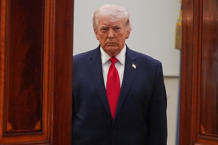 President Donald Trump arrives from the Blue Room to speak about the Iran war from the Cross Hall of the White House on Wednesday.