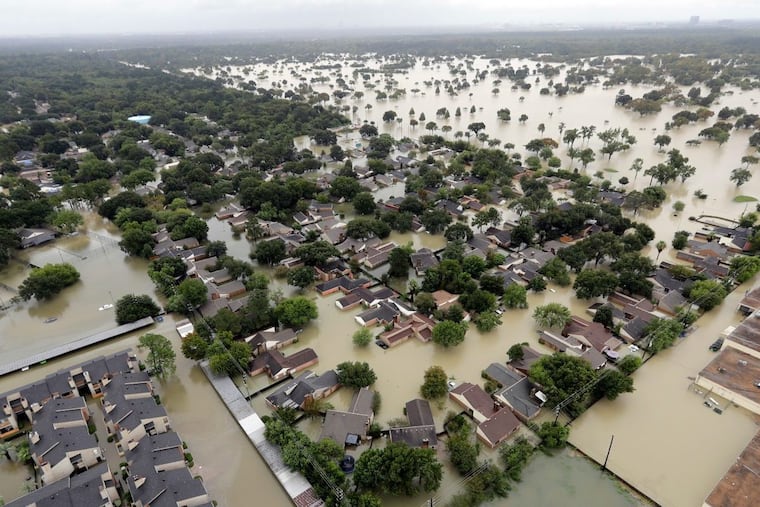 FILE – In this Aug. 29, 2017, file photo, a neighborhood near Addicks Reservoir are flooded by rain from Tropical Storm Harvey in Houston. Houston area officials said Monday, April 9, 2018, during a congressional hearing that they weren’t aware of forecasts by federal authorities regarding flooding risks from local reservoirs that ended up inundating thousands of homes during Hurricane Harvey.