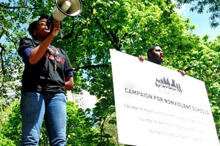 Wearing shirts that read "We are not a flash mob," teens from the Campaign for Nonviolent Schools gathered in Rittenhouse Square today. ( Sarah Schu / Staff Photographer )