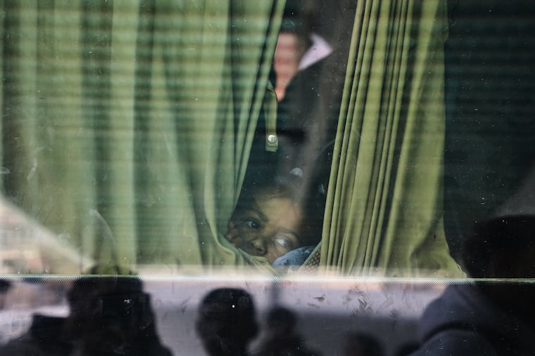 Juman Al-Najjar, a 3-year-old Palestinian patient, looks out from a vehicle with other patients in Khan Younis as they head to the Rafah crossing, leaving the Gaza Strip for medical treatment abroad, Monday, Feb. 2, 2026.