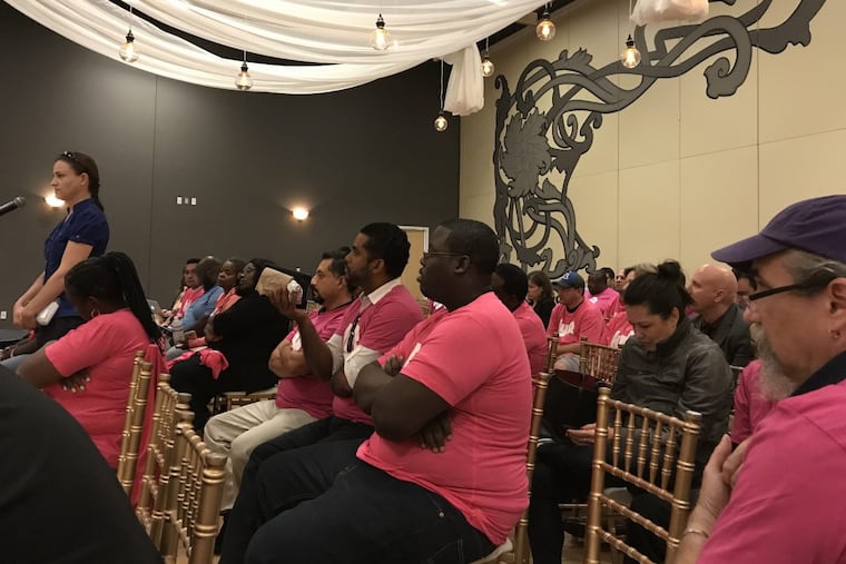 Angel Vogel speaks on behalf of ride-hailing drivers at a PPA hearing on regulations.