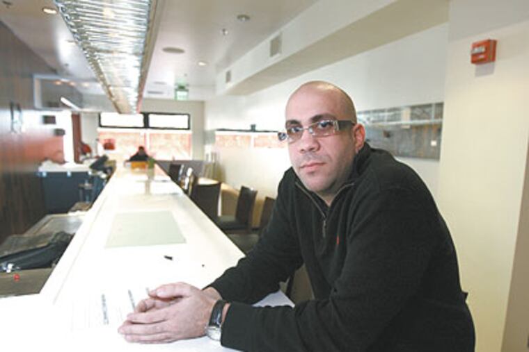 Adam Solomon, a partner in Kokopelli Restaurant & Tequilla Bar, 1904 Chestnut St., has something to offer: Jobs. (David Swanson / Staff Photographer)