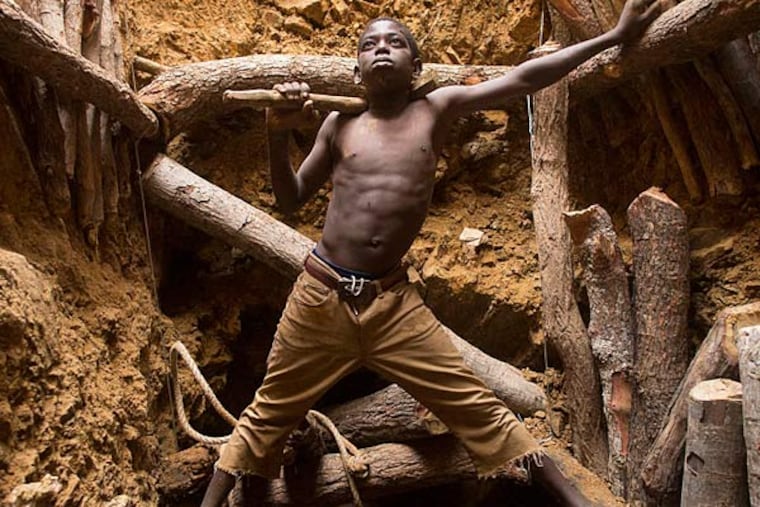 Barefoot and shirtless, Karim Sawadogo, 9, works with his uncle at a gold mine. He has been to school, but only for a while. "My dream," he says, "is to make enough money so I don't have to do this anymore."