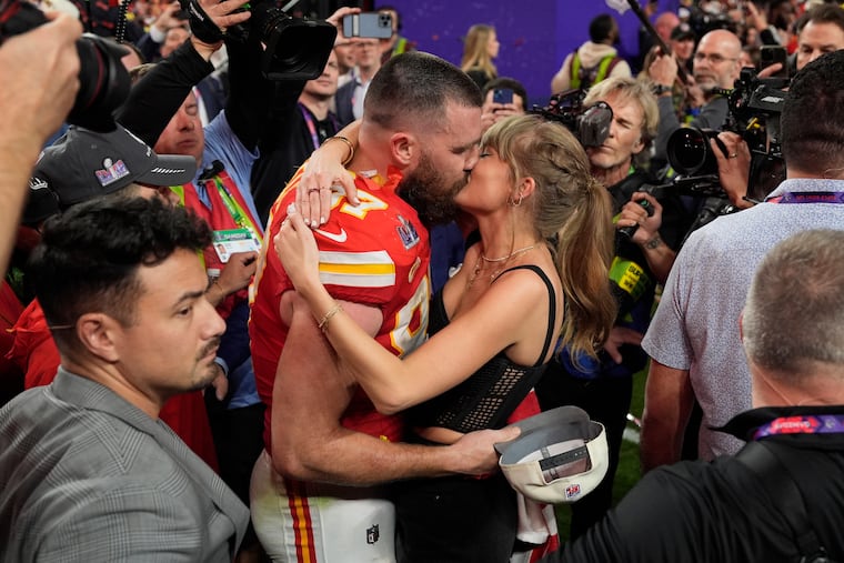 Kansas City Chiefs tight end Travis Kelce (87) kisses Taylor Swift after the Kansas City Chiefs defeated the San Francisco 49ers at the Super Bowl on Feb. 11, 2024, in Las Vegas.