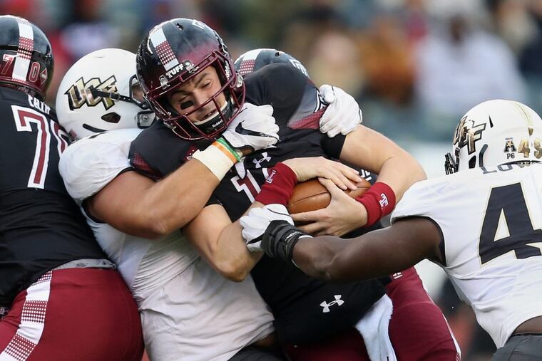 UCF defensive lineman Joey Connors (91) sacks Temple quarterback Frank Nutile (18) in the third quarter of a game at Lincoln Financial Field on Saturday, Nov 18, 2017. Temple lost 45-19.