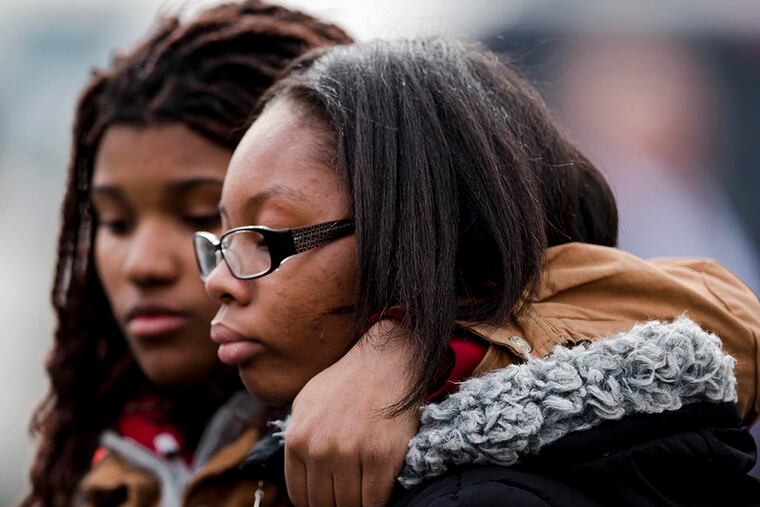 Family members at the viewing of slain Philadelphia Police Officer Robert Wilson III on March 13, 2015, in Philadelphia. ( Matt Rourke / AP Photo )