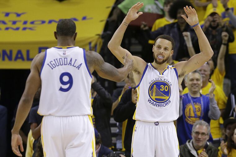 Warriors stars Andre Iguodala (left) and Stephen Curry, seen here during the 2017 playoffs, expressed skepticism that NASA actually landed men on the moon.