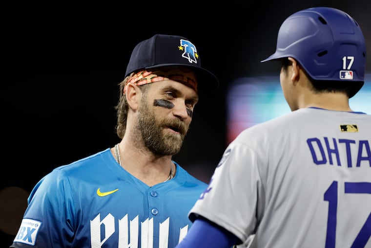 Phillies first baseman Bryce Harper talks with Dodgers designated hitter Shohei Ohtani on April 4. They could meet again on Saturday.