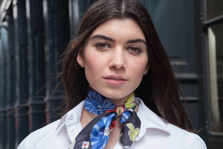 Model Kathryn Brooks wearing a scarf in a springtime pattern.