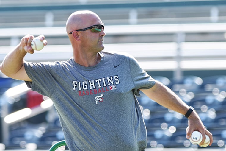 Reading Phillies Manager Dusty Wathan throws at batting practice prior
to the game against the Harrisburg Senators Monday, May 11, 2015 in
Harrisburg. (Philadelphia Inquirer/Bradley C Bower)