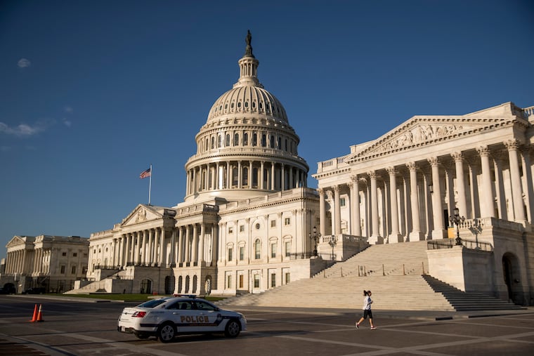 In this March 27, 2020, file photo the Capitol is seen as House lawmakers prepare to debate emergency coronavirus response legislation on Capitol Hill in Washington.