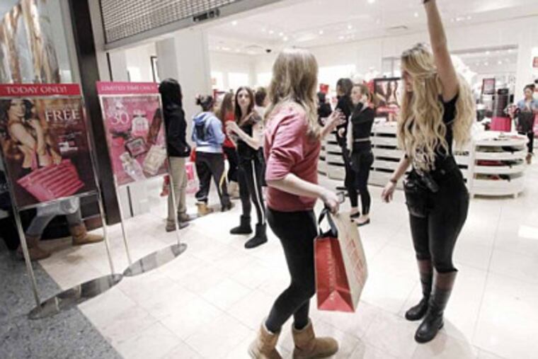 The line went down the mall for Victorias Secret in the Deptford Mall. Store associates (far right) had to monitor the exit to be sure people were not sneaking in on November 23, 2012. ( ELIZABETH ROBERTSON / Staff Photographer )