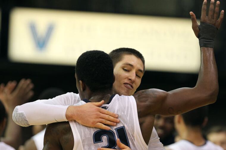 Villanova's Ryan Arcidiacono celebrates with his teammate Dylan Ennis late in the 2nd half. (David Maialetti/Staff Photographer)
