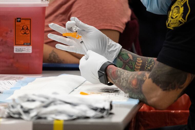 Philadelphia Fire Department EMS Paramedics administer vaccine last month.