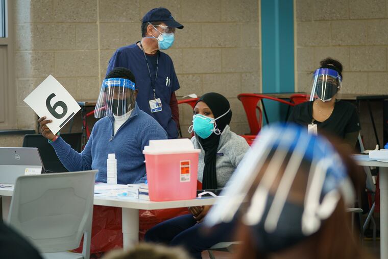 Members of the Health Department Clinic Staff work at the Martin Luther King Jr. Older Adult Center, one of three Philadelphia clinics that will be able to vaccinate up to 500 people each per day.