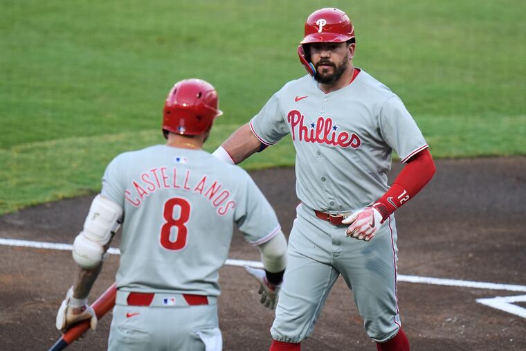 Kyle Schwarber (right) and Nick Castellanos each homered in the Phillies' 8-4 win over the Rays.