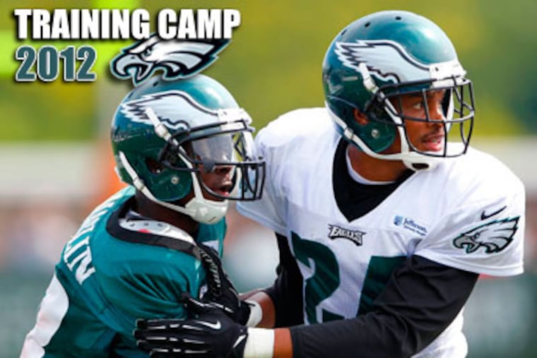 Jeremy Maclin, left, is defended by cornerback Nnamdi Asomugha at Sunday afternoon's practice. (Rich Schultz/AP)