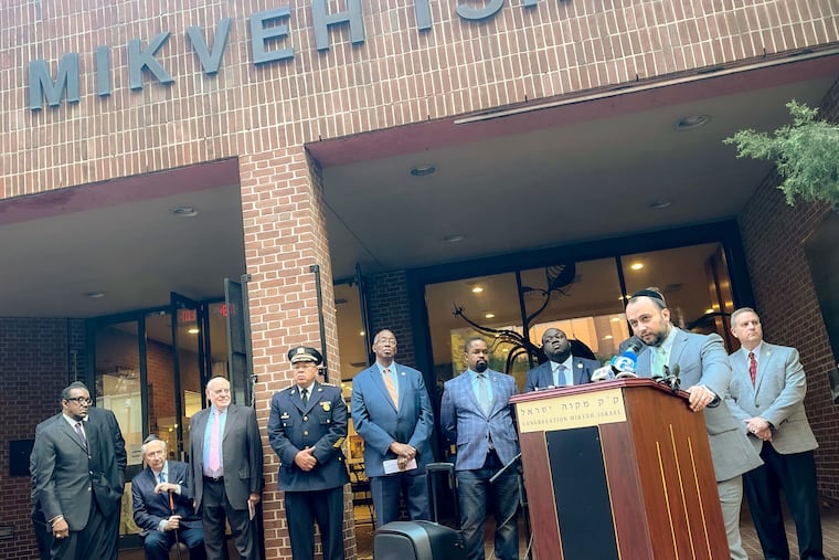 Rabbi Yosef Zarnighian, of Congregation Mikveh Israel, speaks at a news conference on Wednesday, decrying antisemitism after the synagogue was struck by vandalism and arson.