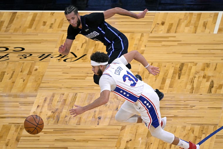 Sixers guard Seth Curry (31) heads upcourt after stealing the ball from Orlando Magic guard Michael Carter-Williams (7) during the second half.