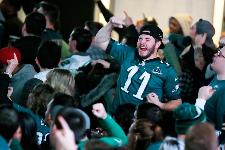 Adam Naugle of Mantua, N.J., cheers the Eagles' first touchdown against the Washington Redskins at Xfinity Live! on Dec. 30, 2018.
