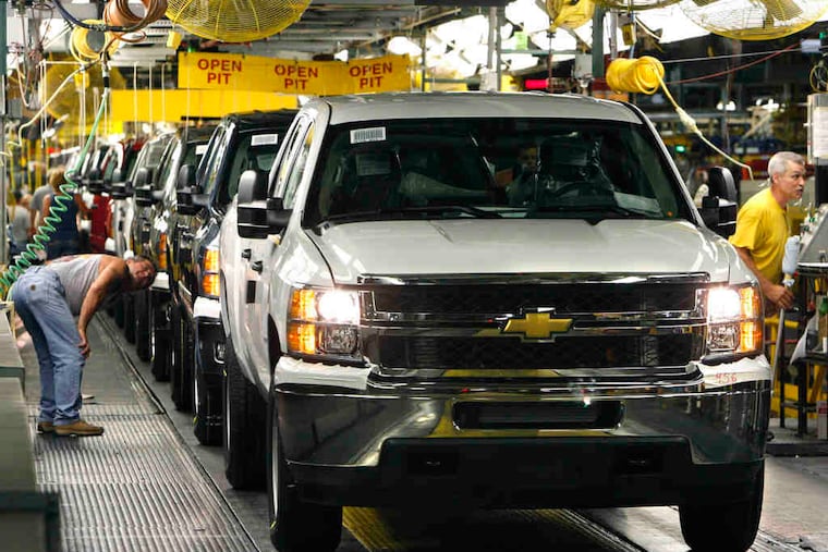2011 Chevrolet Silverados awaited final inspection at the Flint Assembly in Flint, Mich., in June. General Motors Co. says strong demand for its pickups and wagons lifted October sales 3.5 percent and helped the automaker overcome weak car sales.