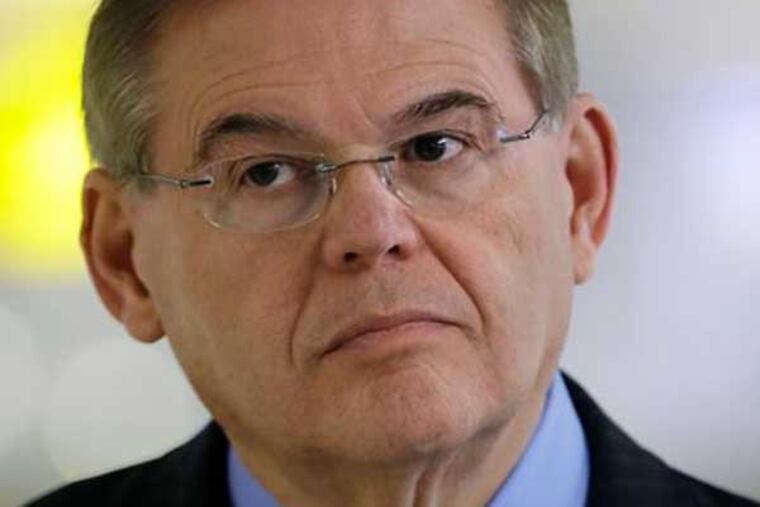 FILE – In this March 1, 2013, file photo Sen. Robert Menendez, D-N.J., participates in a news conference at an airport in Newark, N.J. From the "Keating Five" scandal, one of the more celebrated Congressional ethics cases, to more recent investigations, members of Congress have regularly run into trouble when they cross a sometimes blurry line between helping a supporter and engaging in a quid pro quo. As regards his own Senate Ethics Committee investigation Menendez has said, “No one has bought me, No. 1. No one. Ever.” (AP Photo/Mel Evans, File)