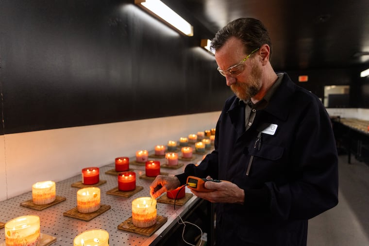 The burn lab at Alene Candles, a key supplier that pioneered the three-wick candle with Bath & Body Works, in New Albany, Ohio, on May 13, 2026. Technicians in the burn lab measure the soot content and height of flame from candles in every batch.