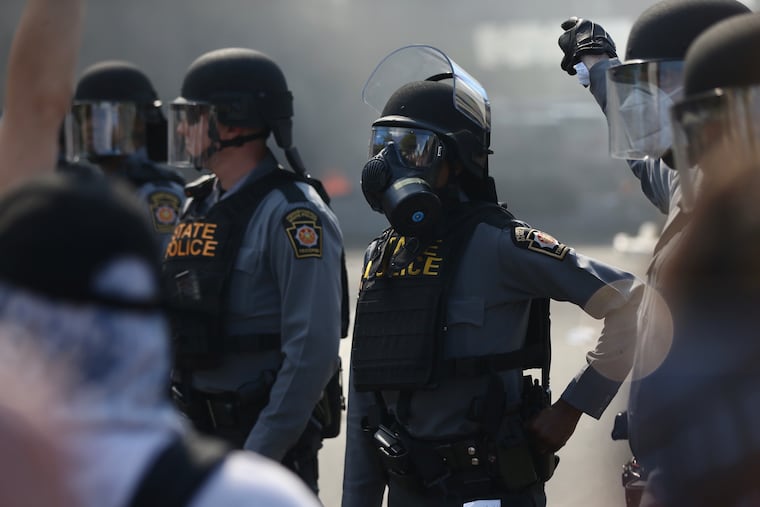 State police face protesters on Vine Street amid demonstrations in Philadelphia against the death of George Floyd on May 30.
