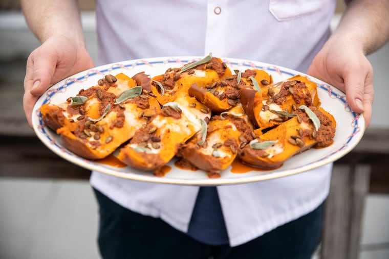 Honeynut squash with stracchino cheese, nduja vinaigrette and spiced pumpkin seeds made by Ed Crochet of Fiore, at Michael Ferreri's home in Philadelphia.
