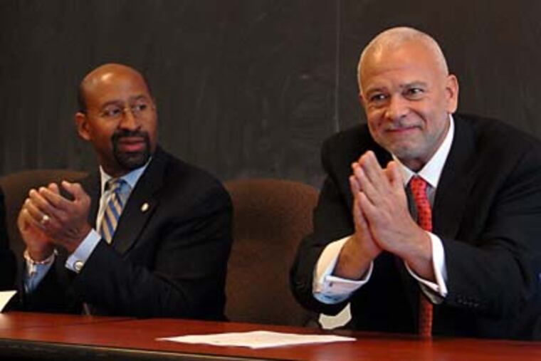 FILE: Michael P. Kelly acknowledges the applause as he is introduced as the new Philadelphia Housing Authority director in November 2010. Mayor Nutter is at left. (TOM GRALISH/Staff)
