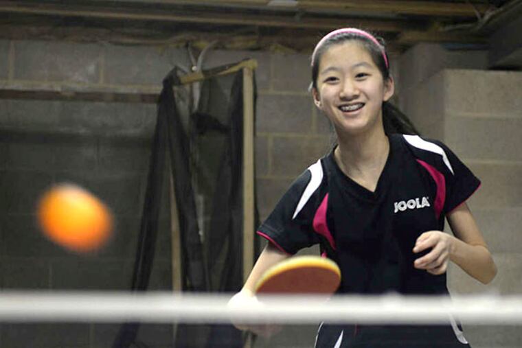 Amy Wang, 12, of Sewell, will be the youngest player on the U.S. national women's team at the 2015 World Table Tennis Championships in China. TOM GRALISH / Staff Photographer