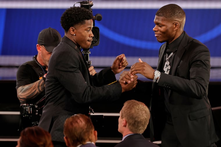 VJ Edgecombe, left, is congratulated by Cedric Coward after being selected third by the Philadelphia 76ers In the first round of the NBA basketball draft, Wednesday, June 25, 2025, in New York. (AP Photo/Adam Hunger)