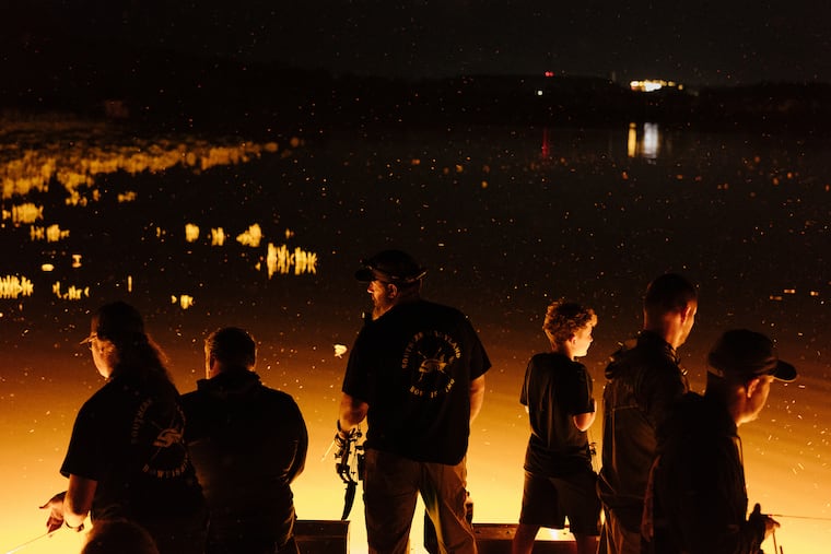 A nighttime snakehead fishing excursion led by Loriann Bowman Bates, left, and Bill Bates, center, on the Potomac River this month.