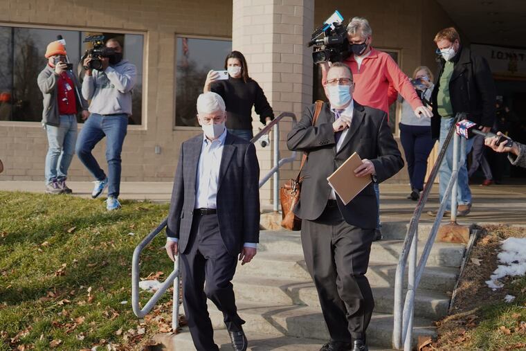 Former Michigan Gov. Rick Snyder exits after video arraignment at the Genesee County Jail in Flint, Mich., on Jan. 14, 2021, on new Flint Water Crisis charges.