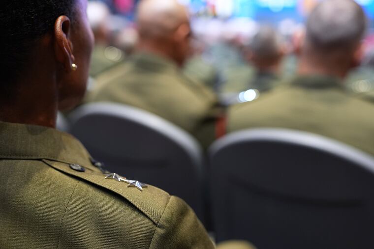 U.S. military senior leadership listen as President Donald Trump speaks at Marine Corps Base Quantico in September in Quantico, Va.