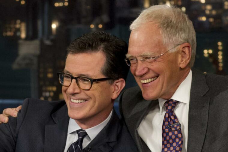 David Letterman (right) with incoming host Stephen Colbert. (CBS)