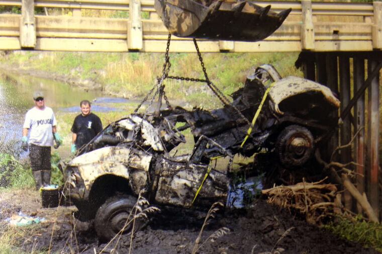A 1960 Studebaker is lifted from Brule Creek near Alcester, S.D., next to the gravel pit Cheryl Miller and Pamella Jackson were driving to in 1971 when they disappeared.