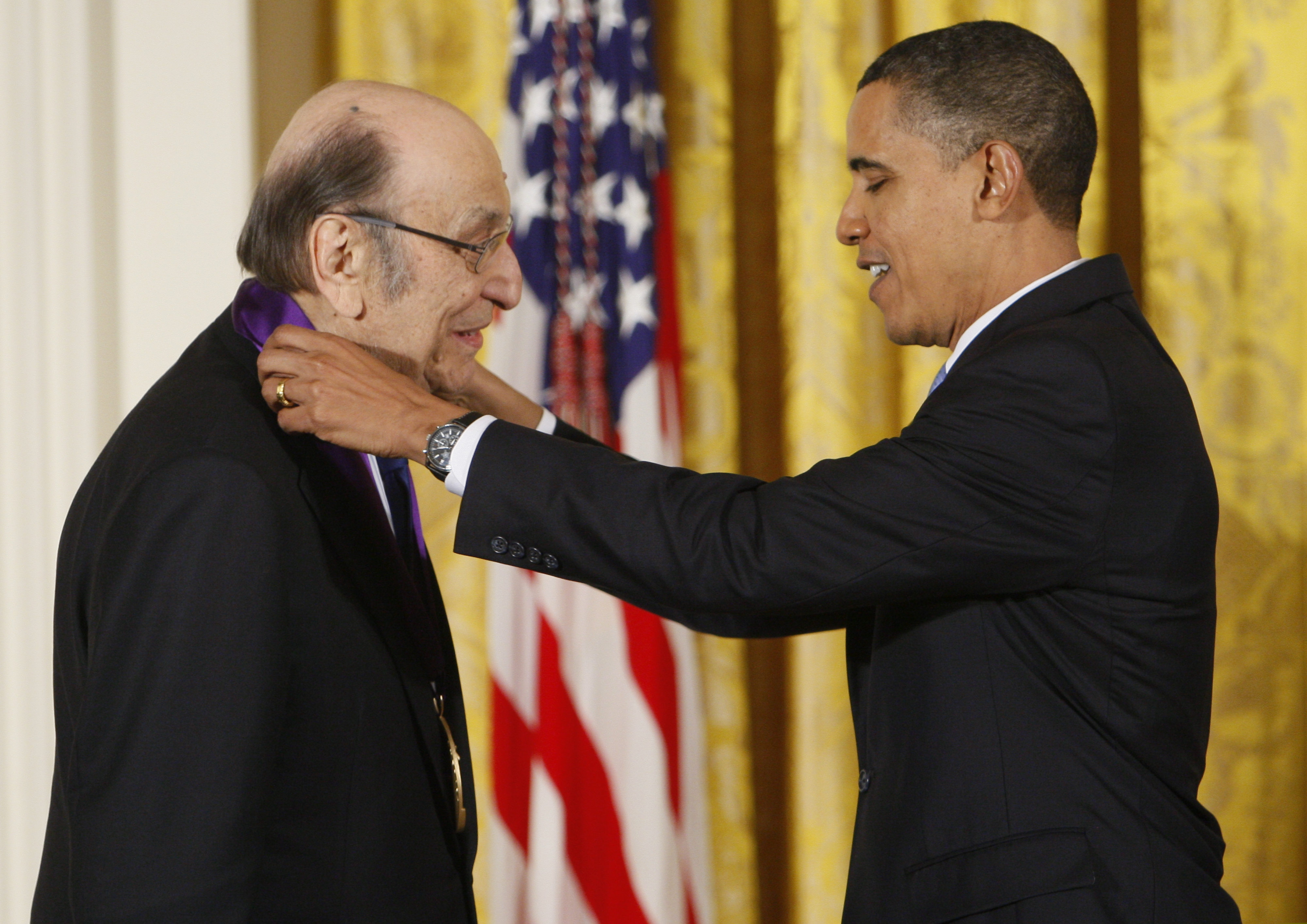 President Barack Obama presents a 2009 National Medal of Arts to Milton Glaser, in the East Room of the White House in Washington. Glaser, the designer who created the “I (HEART) NY” logo and the famous Bob Dylan poster with psychedelic hair, died Friday, June 26, 2020, his 91st birthday.