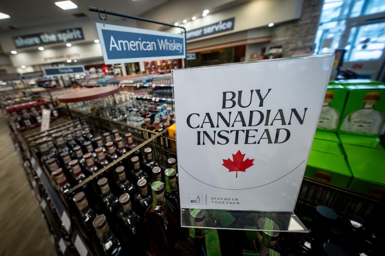 A sign is placed in front of the American whiskey section at a Vancouver liquor store after top selling American-made products were removed from shelves in Canada, Feb. 2, 2025, in response to President Donald Trump announcing tariffs on Canadian imports. He later delayed the tariffs.