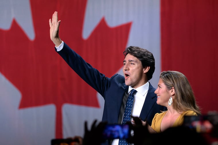 Liberal leader Justin Trudeau and wife Sophie Gregoire Trudeau wave as they go on stage at Liberal election headquarters in Montreal, Monday, Oct. 21, 2019.