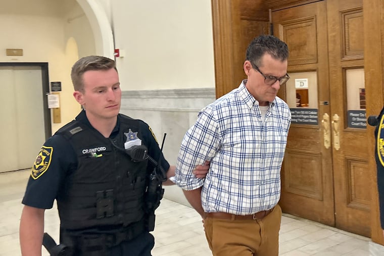 John Richards IV is escorted out of a courtroom in the Montgomery County Courthouse on Monday. Richards was sentenced to 9 to 23 months in county jail.