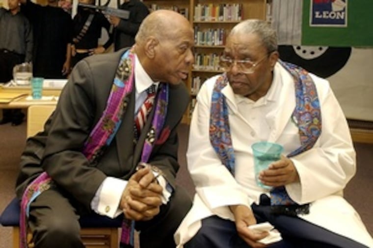 Mr. Evans (left) with Charles E. Brimm during a Black History Month Program, "Glimpsesof the Harlem Renaissance," in 2004 at Dr. Charles E. Brimm Medical Arts High School.