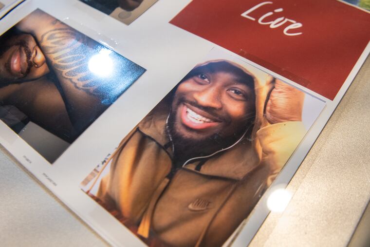 Photos of Naseem Smith laid out on his mother’s kitchen table.