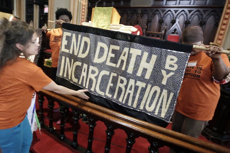 Community members, activists, and supporters of Kempis "Ghani" Songster gathered at the Arch Street Methodist Church in Philadelphia on July 23, 2017.